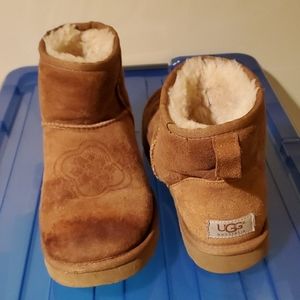 Uggs with flower on top.